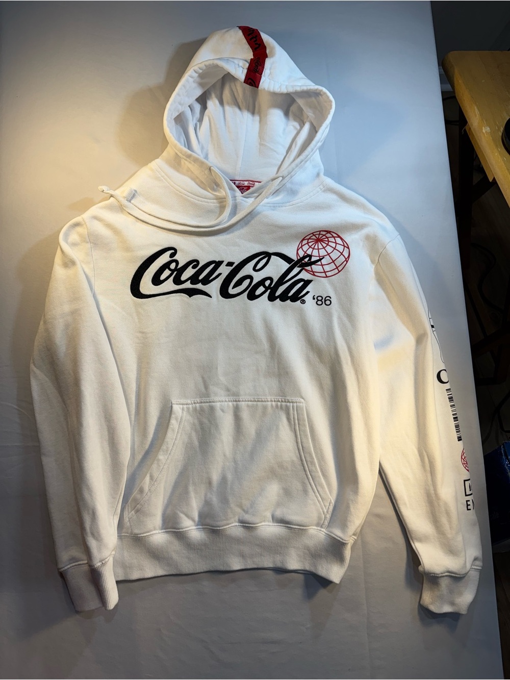 Coca Cola Embroidered White Pullover Hoodie with Black Script and Red Globe.